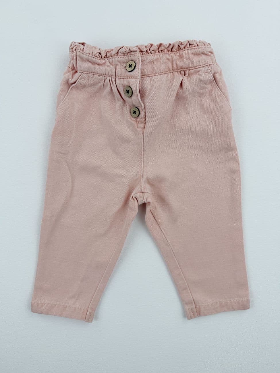Pantalón rosa cintura con volantes – Orchestra – 6 meses (67 cm)