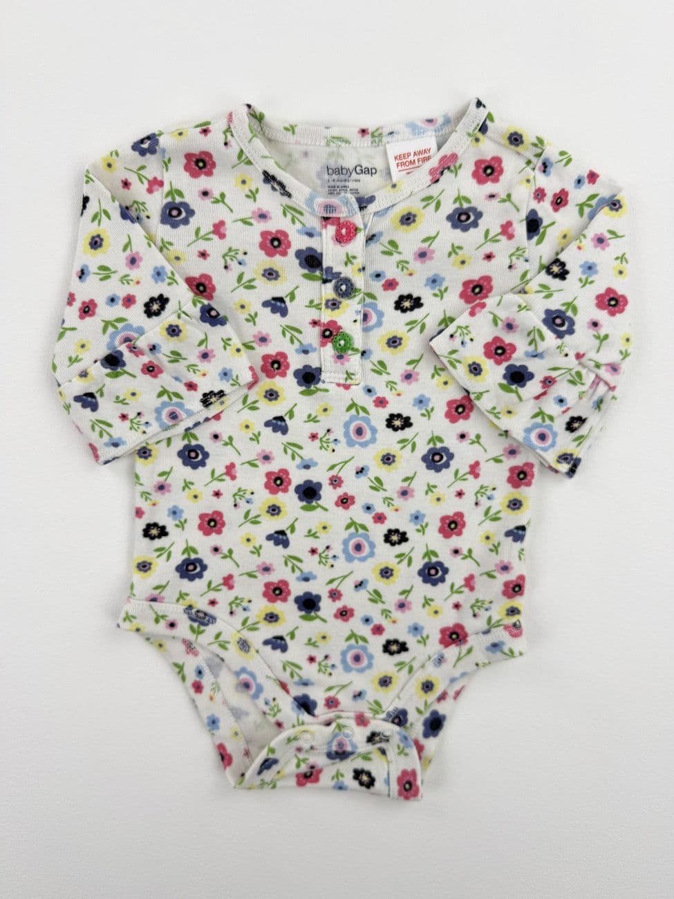 Body de algodón floral – Baby Gap – 3/6 meses